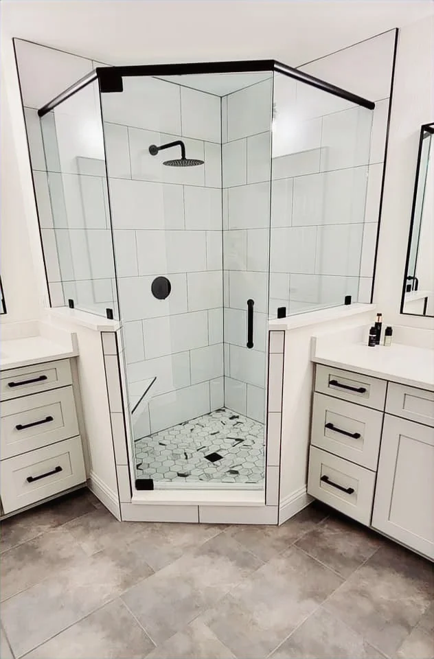Corner frameless glass shower with tile surround