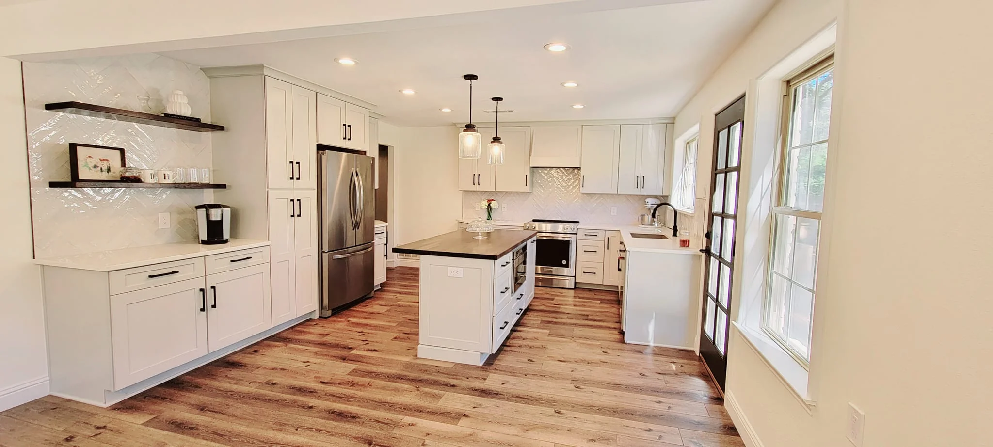 Kitchen remodel with white cabinetry and quartz island, Collin County