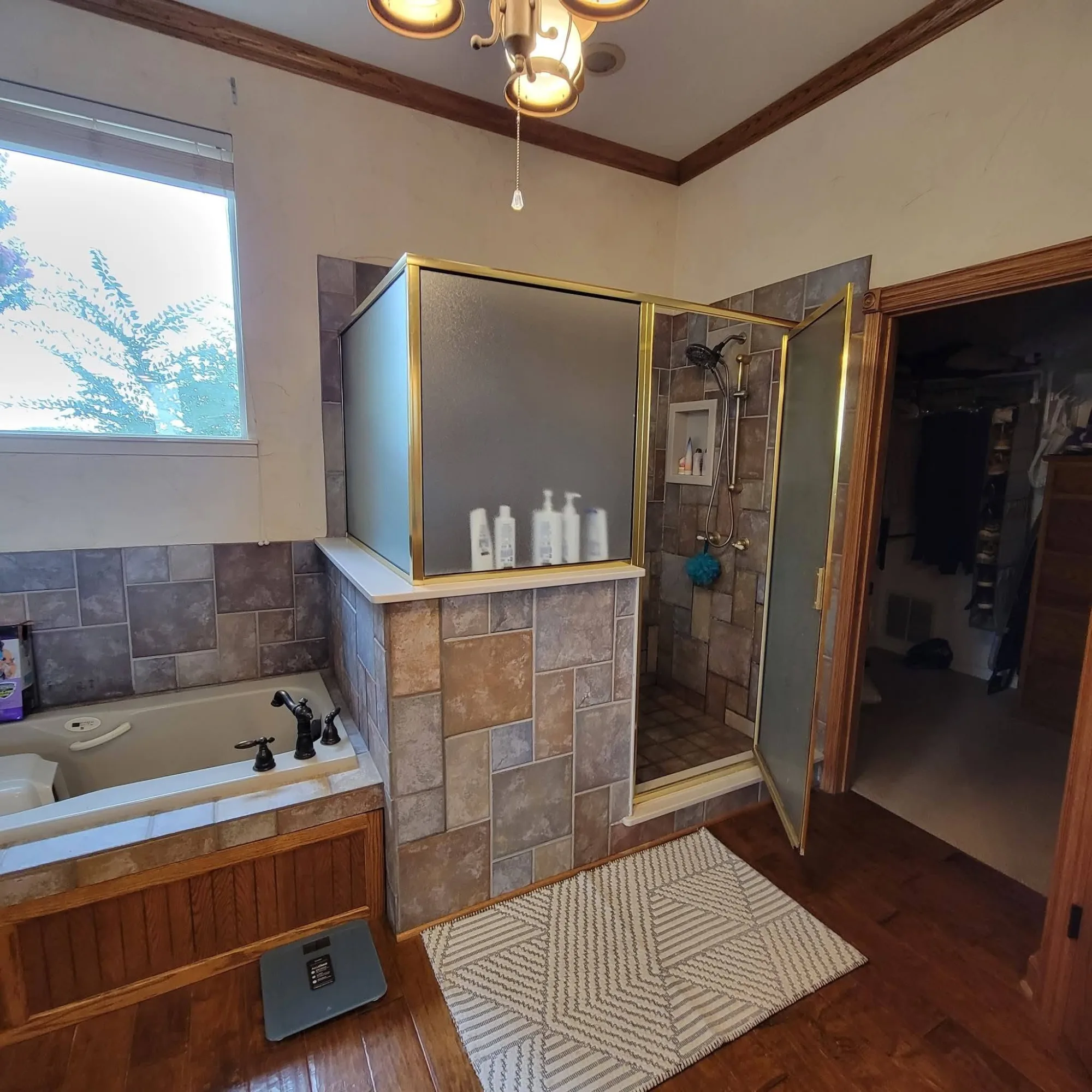 Original primary bath before remodel — dated tile and jetted tub