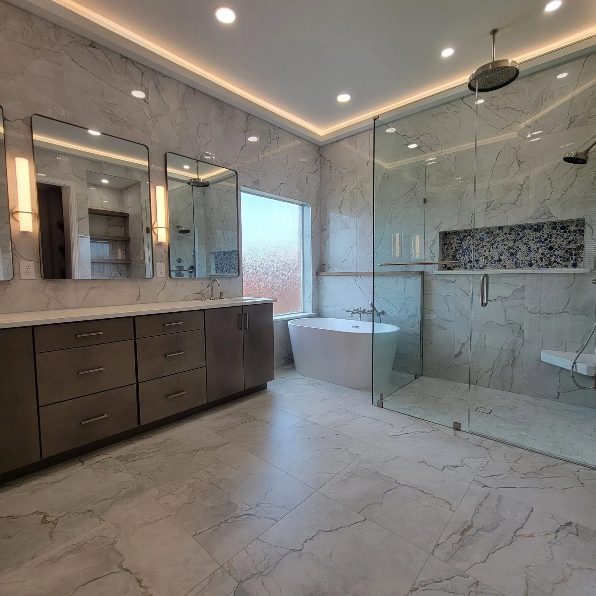 Primary suite remodel with freestanding tub and glass walk-in shower